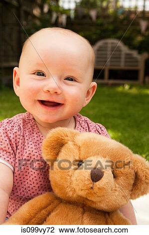 Happy baby girl with teddy bear View Large Photo Image Stock Image - Happy baby girl with teddy bear. Fotosearch