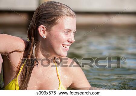 Happy teenage girl in water View Large Photo Image Stock Photography - Happy teenage girl in water. Fotosearch