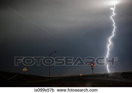 Stock Image - Lightning above a road. Fotosearch