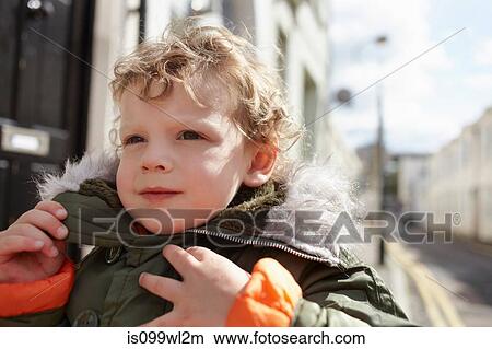 Little boy outdoors, wearing parka View Large Photo Image Picture - Little boy outdoors, wearing parka. Fotosearch
