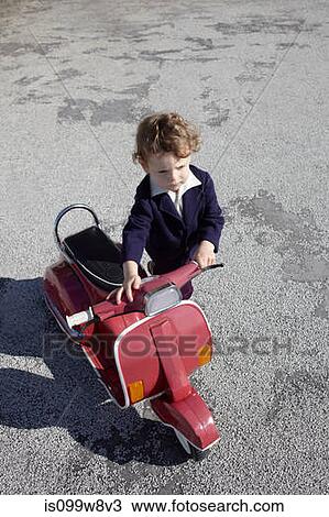 Little boy with red scooter View Large Photo Image Stock Image - Little boy with red scooter. Fotosearch