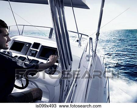 Man driving power boat View Large Photo Image Stock Image - Man driving power boat. Fotosearch
