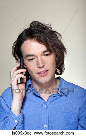 Stock Image - Man on smartphone. Fotosearch