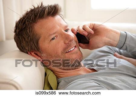 Man on the phone View Large Photo Image Stock Photograph - Man on the phone. Fotosearch