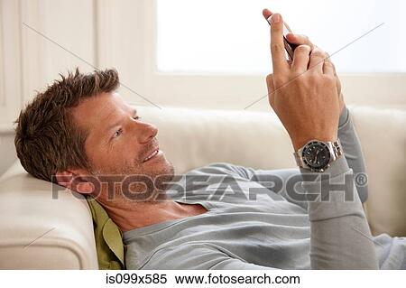 Man using smartphone View Large Photo Image Stock Photography - Man using smartphone. Fotosearch