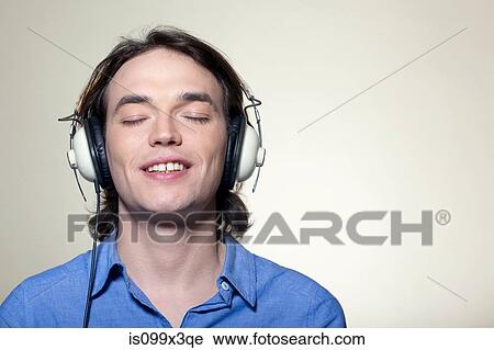 Man wearing headphones View Large Photo Image Stock Image - Man wearing headphones. Fotosearch