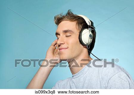 Stock Photo - Man wearing headphones. Fotosearch