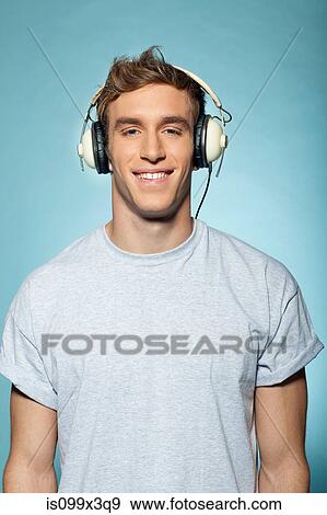 Stock Photo - Man wearing headphones. Fotosearch