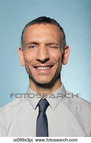Man winking View Large Photo Image Stock Image - Man winking. Fotosearch