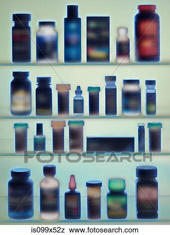 Medicine bottles in cabinet View Large Photo Image Stock Photo - Medicine bottles in cabinet. Fotosearch