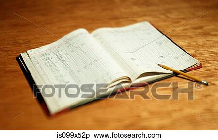 Open account book on wooden desktop View Large Photo Image Stock Photography - Open account book on wooden desktop. Fotosearch