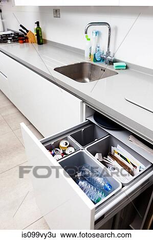 Open kitchen drawer with recycling View Large Photo Image Stock Photograph - Open kitchen drawer with recycling. Fotosearch