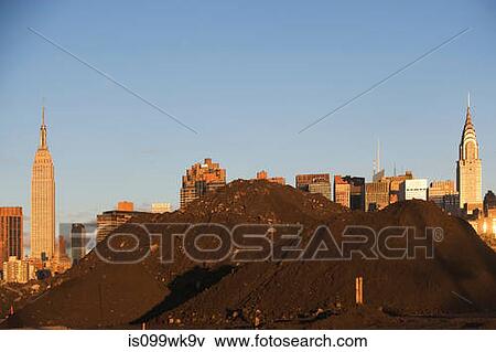 Pile of soil in front of Manhattan skyline, New York City View Large Photo Image Stock Photo - Pile of soil in front of Manhattan skyline, New York City. Fotosearch