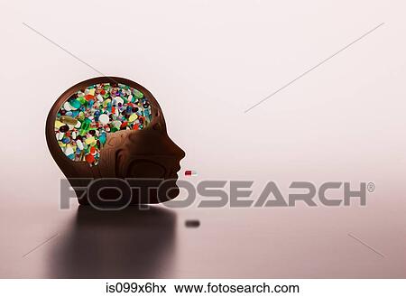 Pills in model head View Large Photo Image Stock Photo - Pills in model head. Fotosearch