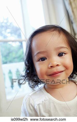 Portrait of a little girl smiling at camera View Large Photo Image Stock Image - Portrait of a little girl smiling at camera. Fotosearch