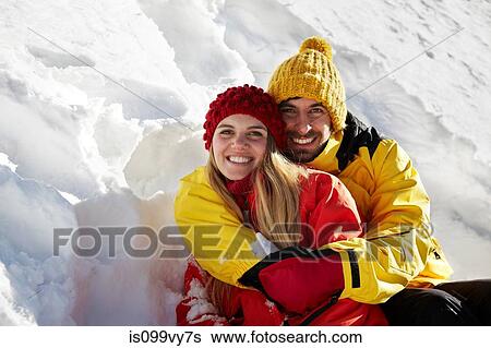 Portrait of couple hugging, wearing winter clothes View Large Photo Image Stock Photograph - Portrait of couple hugging, wearing winter clothes. Fotosearch