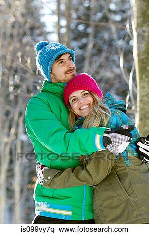 Portrait of couple hugging, wearing winter clothes View Large Photo Image Stock Photography - Portrait of couple hugging, wearing winter clothes. Fotosearch