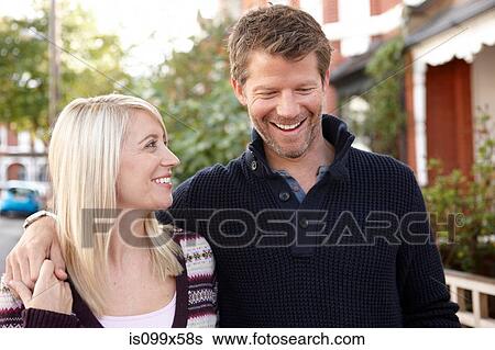 Portrait of couple, man with arm around woman View Large Photo Image Stock Photograph - Portrait of couple, man with arm around woman. Fotosearch