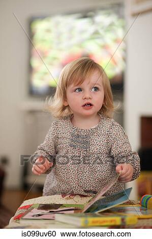 Portrait of toddler with books View Large Photo Image Stock Image - Portrait of toddler with books. Fotosearch