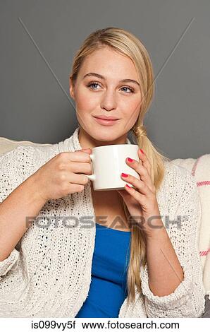 Portrait of woman holding cup View Large Photo Image Stock Image - Portrait of woman holding cup. Fotosearch