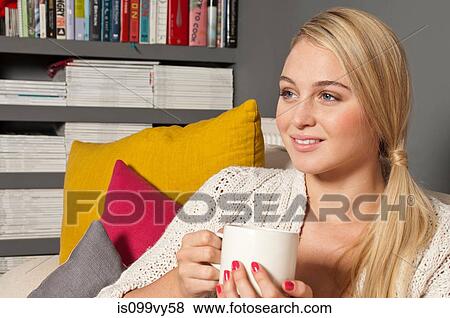 Portrait of woman holding cup View Large Photo Image Stock Photo - Portrait of woman holding cup. Fotosearch