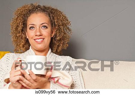 Stock Photograph - Portrait of woman holding cup. Fotosearch