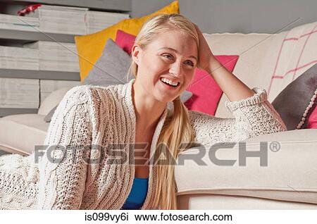 Portrait of woman leaning on sofa View Large Photo Image Stock Image - Portrait of woman leaning on sofa. Fotosearch