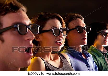 Row of people watching 3D movie View Large Photo Image Picture - Row of people watching 3D movie. Fotosearch