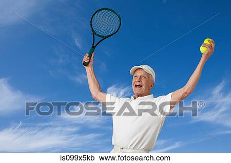 Senior male tennis player cheering View Large Photo Image Stock Image - Senior male tennis player cheering. Fotosearch