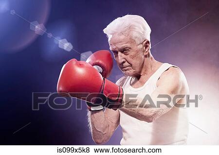 Stock Photo - Senior man boxing. Fotosearch