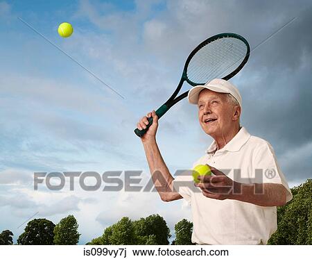 Senior man playing tennis View Large Photo Image Stock Image - Senior man playing tennis. Fotosearch