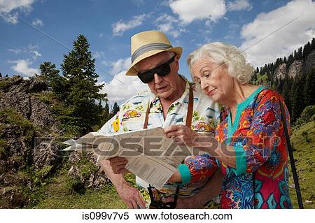 Senior tourist couple looking at map View Large Photo Image Stock Photography - Senior tourist couple looking at map. Fotosearch