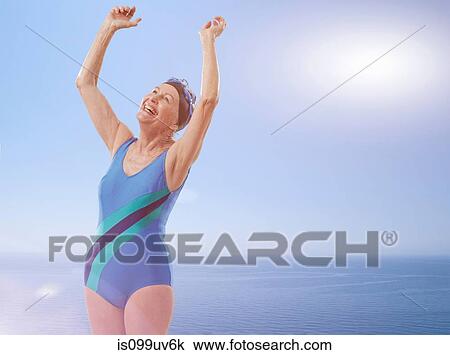 Senior woman wearing swimsuit cheering with arms raised View Large Photo Image Stock Image - Senior woman wearing swimsuit cheering with arms raised. Fotosearch