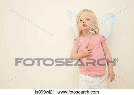 Toddler wearing wings, holding wand View Large Photo Image Stock Image - Toddler wearing wings, holding wand. Fotosearch