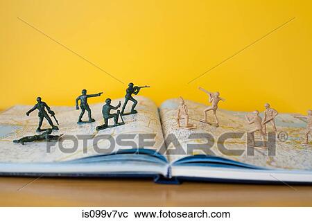 Toy soldiers fighting on map View Large Photo Image Stock Image - Toy soldiers fighting on map. Fotosearch
