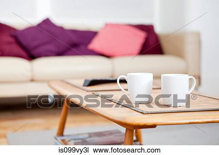 Two coffee cups on coffee table View Large Photo Image Stock Image - Two coffee cups on coffee table. Fotosearch