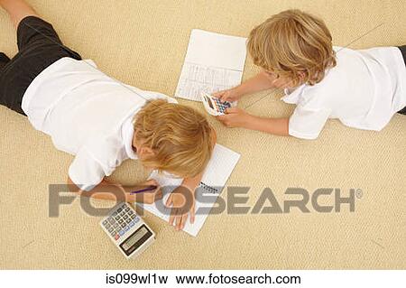 Two schoolboys doing homework View Large Photo Image Stock Photo - Two schoolboys doing homework. Fotosearch