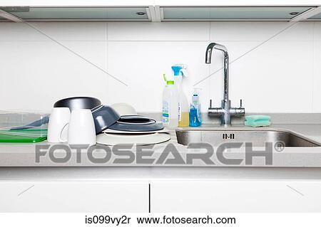 Washing up on kitchen sink View Large Photo Image Stock Photography - Washing up on kitchen sink. Fotosearch