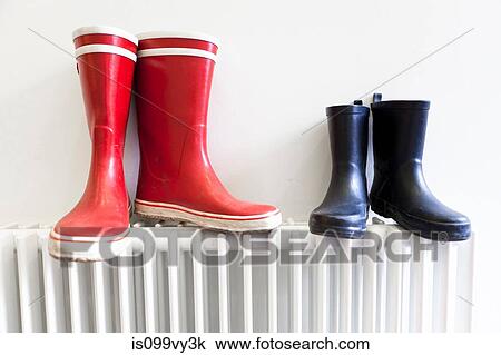Wellington boots on radiator View Large Photo Image Stock Image - Wellington boots on radiator. Fotosearch