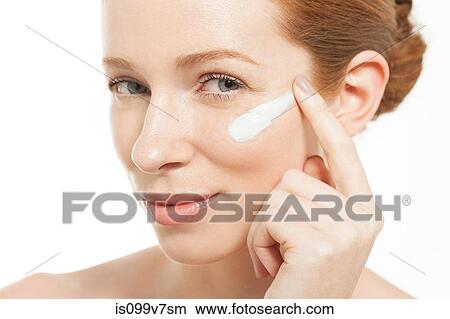 Woman applying moisturiser View Large Photo Image Picture - Woman applying moisturiser. Fotosearch