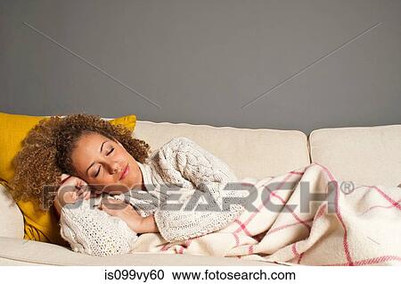 Woman asleep on sofa View Large Photo Image Stock Image - Woman asleep on sofa. Fotosearch