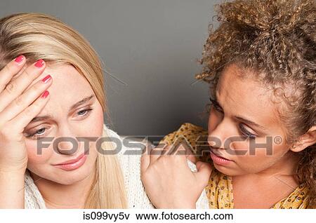 Woman consoling friend View Large Photo Image Stock Photo - Woman consoling friend. Fotosearch