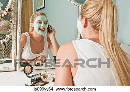 Woman in face mask on the phone View Large Photo Image Picture - Woman in face mask on the phone. Fotosearch