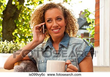 Stock Image - Woman on cell phone. Fotosearch