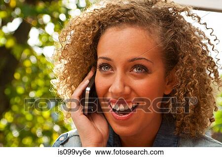 Stock Image - Woman on cell phone. Fotosearch