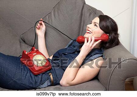 Woman on sofa on the phone View Large Photo Image Stock Photography - Woman on sofa on the phone. Fotosearch