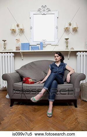 Woman on sofa with telephone View Large Photo Image Stock Photography - Woman on sofa with telephone. Fotosearch