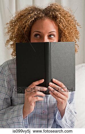 Stock Image - Woman reading book. Fotosearch