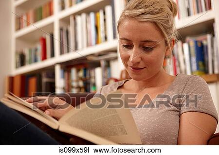 Stock Image - Woman reading book. Fotosearch