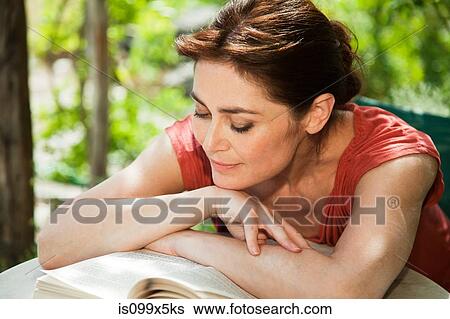 Stock Photograph - Woman reading book. Fotosearch